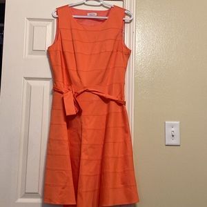 Never worn womens dress. Deep Peach/Pink color.
